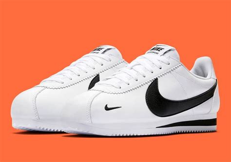 Nike white shoes black swoosh